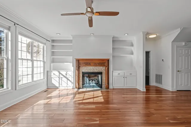 a view of a room with furniture and wooden floor