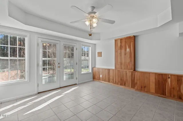 a view of empty room with furniture