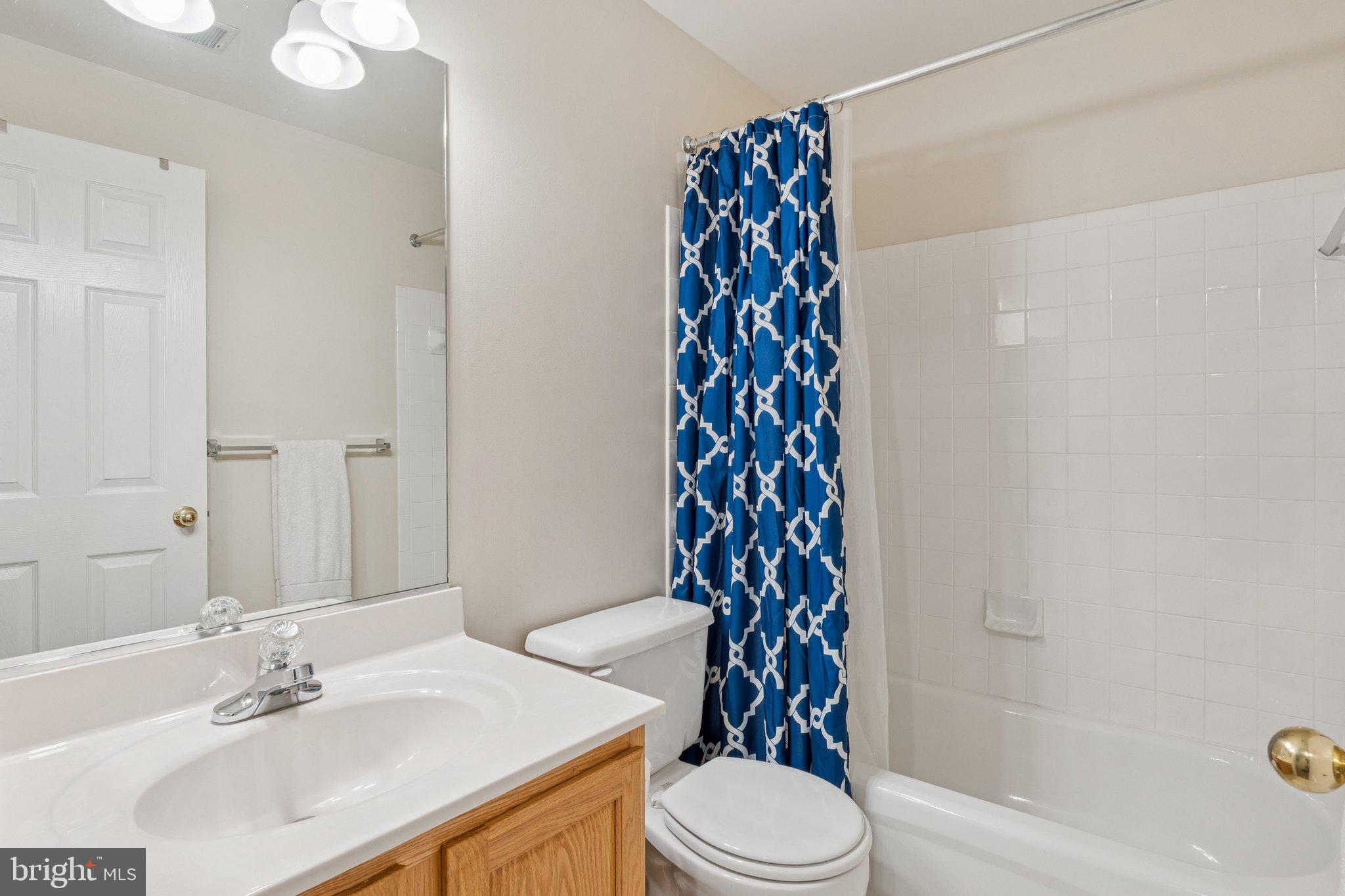 856 Stonehurst Drive Annapolis, MD 21409 - Photo 13 of 31 a bathroom with a sink a toilet and shower