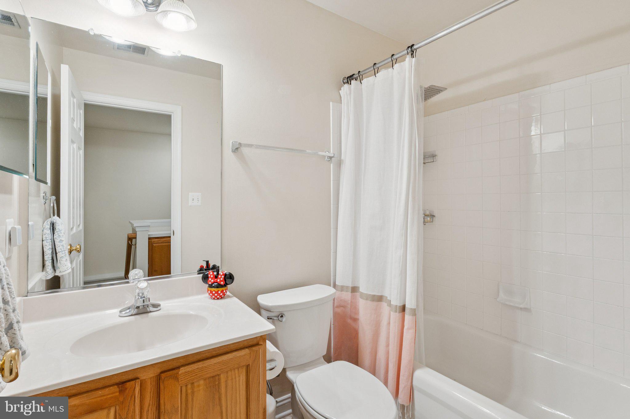 856 Stonehurst Drive Annapolis, MD 21409 - Photo 19 of 31 a bathroom with a sink toilet and shower
