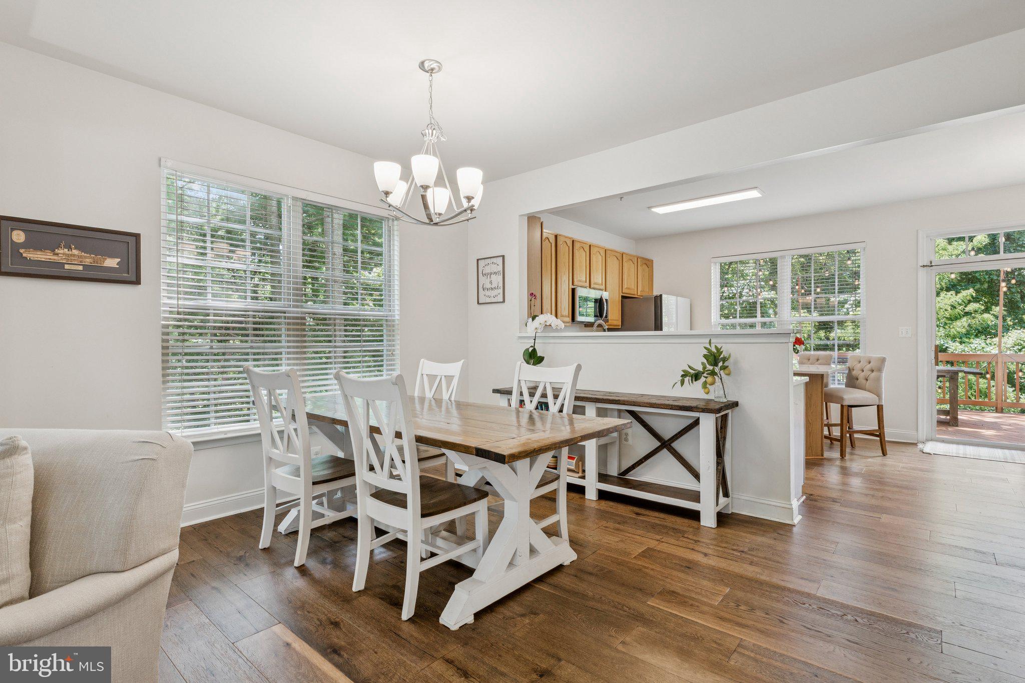 856 Stonehurst Drive Annapolis, MD 21409 - Photo 8 of 31 a view of a dining room with furniture window and wooden floor