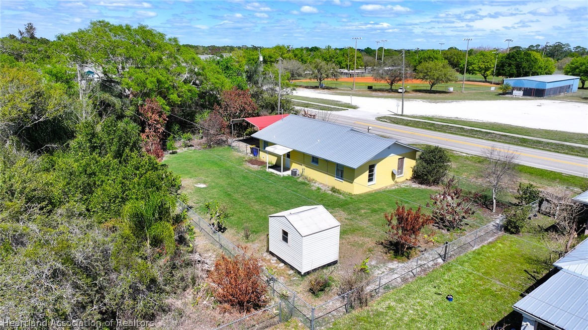 3303 Lakewood Road Sebring, FL 33875 - Photo 11 of 34 an aerial view of a house with a yard and lake view