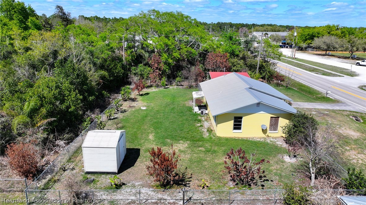 3303 Lakewood Road Sebring, FL 33875 - Photo 12 of 34 an aerial view of a house with a yard