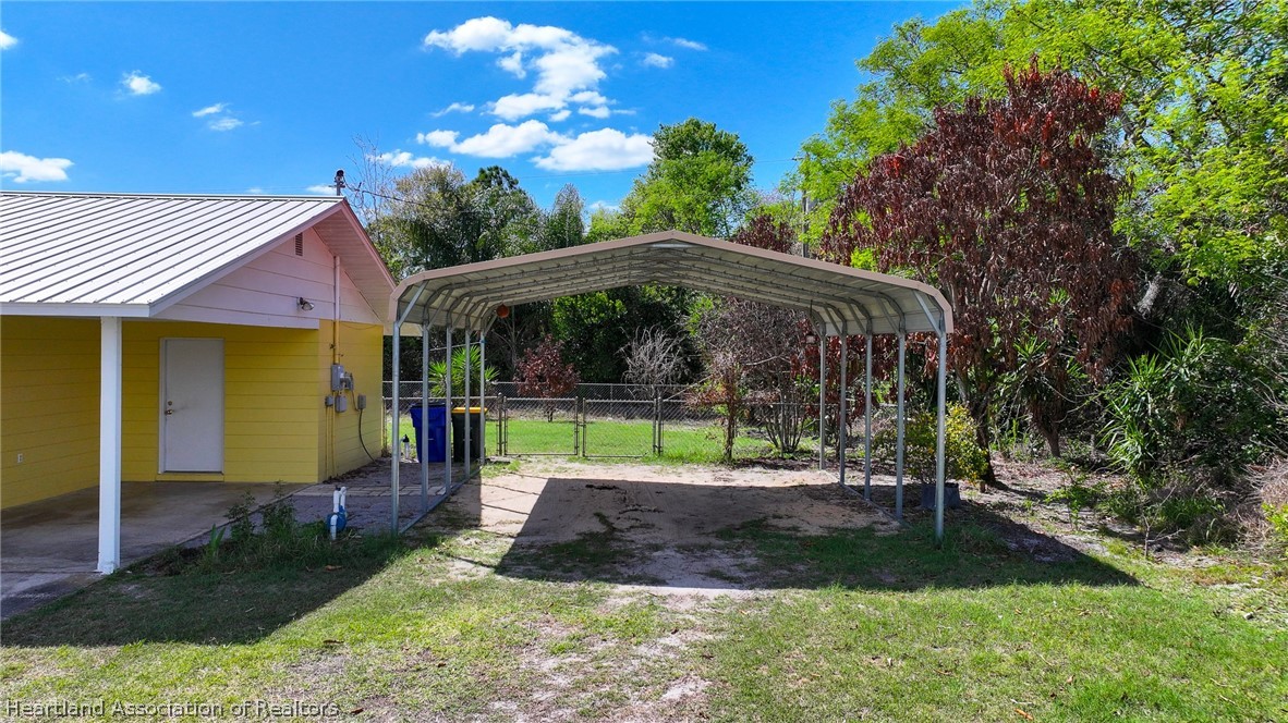 3303 Lakewood Road Sebring, FL 33875 - Photo 17 of 34 a front view of a house with garden