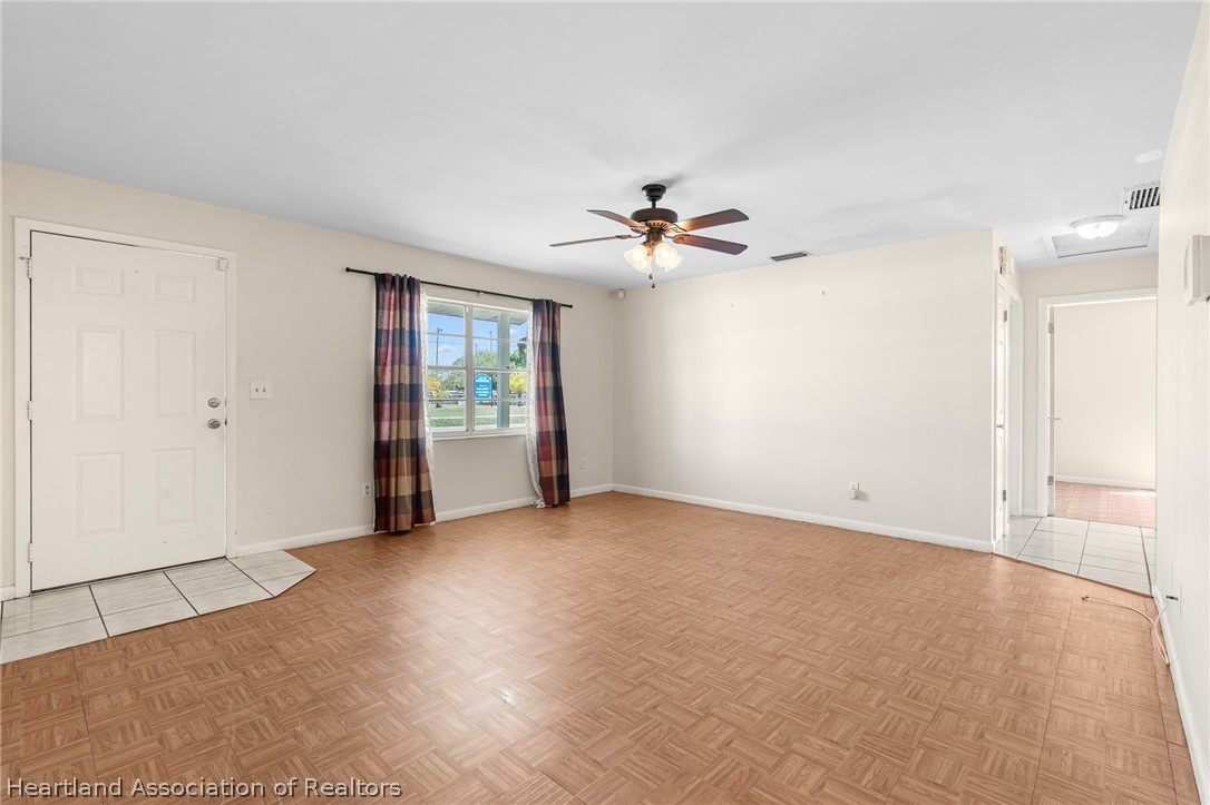 3303 Lakewood Road Sebring, FL 33875 - Photo 19 of 34 a view of an empty room with a window