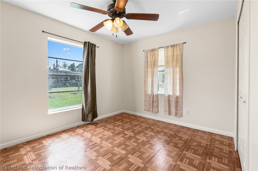 3303 Lakewood Road Sebring, FL 33875 - Photo 27 of 34 a view of an empty room with window and cabinet