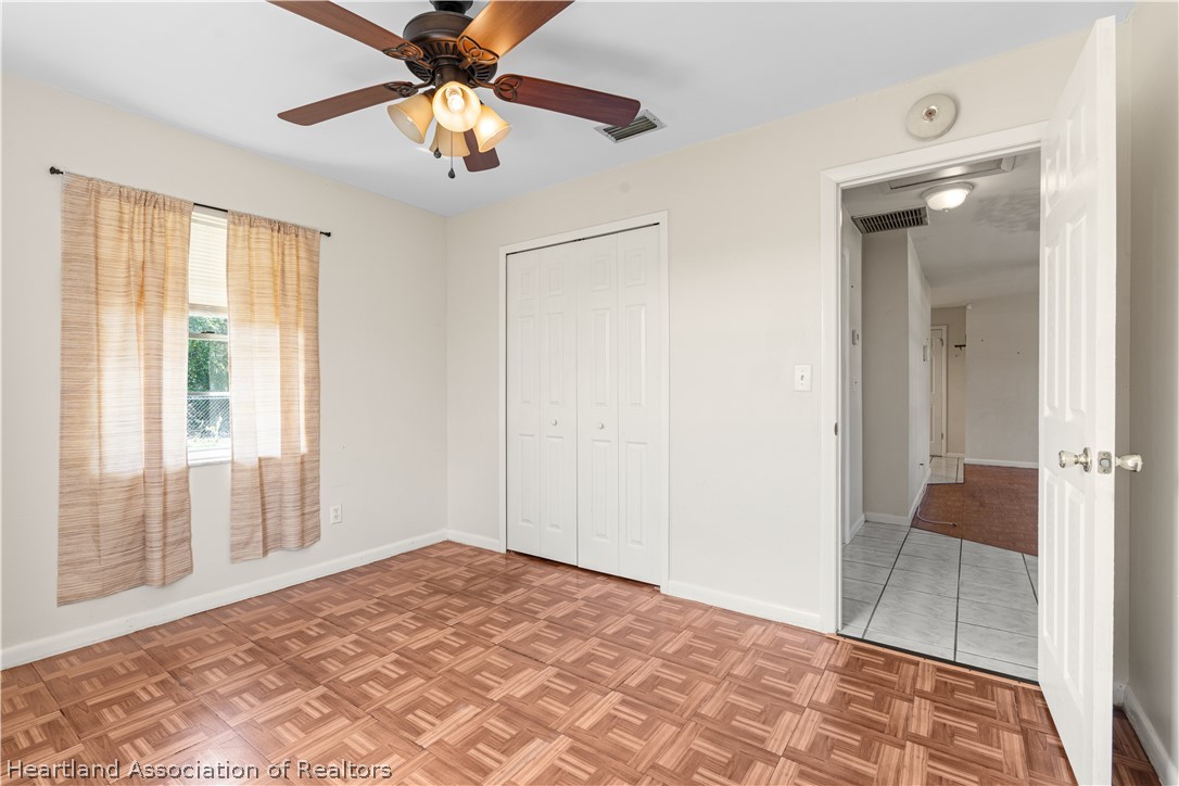 3303 Lakewood Road Sebring, FL 33875 - Photo 28 of 34 a view of a room with a ceiling fan and bathroom