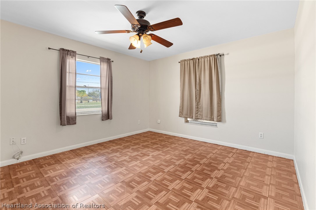 3303 Lakewood Road Sebring, FL 33875 - Photo 30 of 34 a view of an empty room with a window