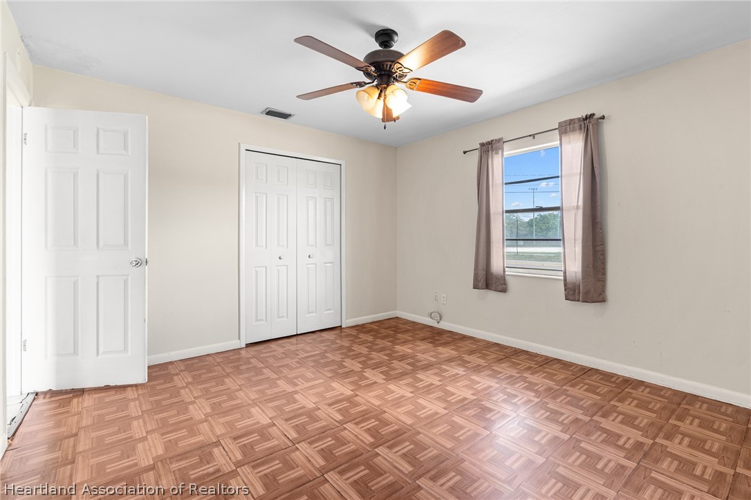3303 Lakewood Road Sebring, FL 33875 - Photo 31 of 34 a view of an empty room with a window