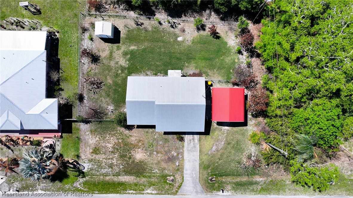 3303 Lakewood Road Sebring, FL 33875 - Photo 6 of 34 an aerial view of a house with yard and swimming pool