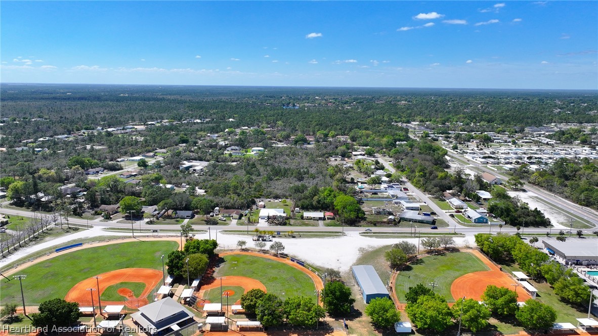 3303 Lakewood Road Sebring, FL 33875 - Photo 8 of 34 an aerial view of residential houses and lake