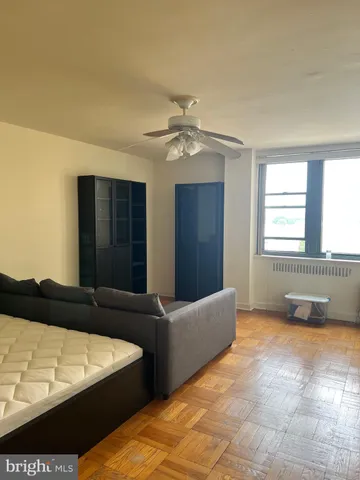 a living room with furniture and a window