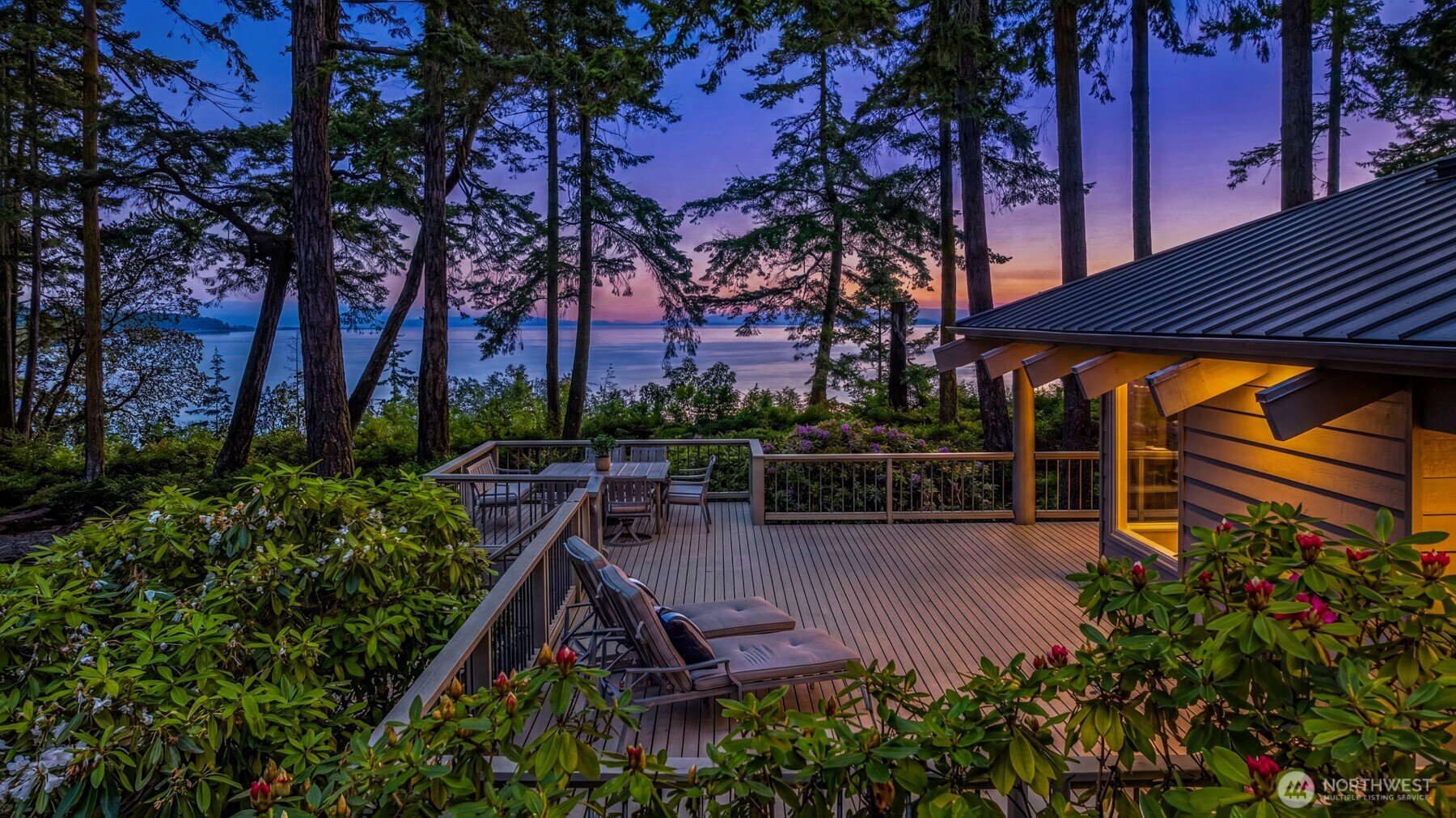 an outdoor space with seating area and trees