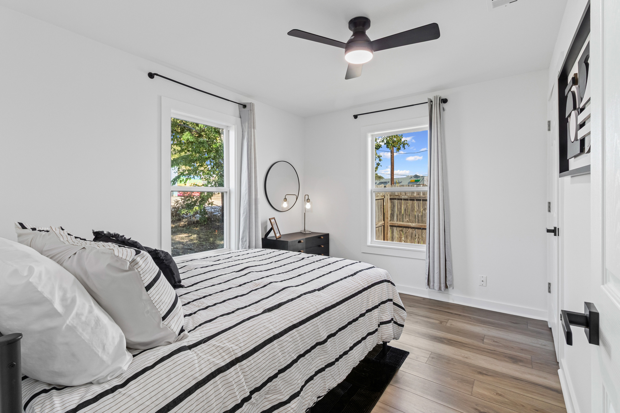 901 North Church Street Georgetown, TX 78626 - Photo 11 of 32 Bedroom with light wood finished floors and ceiling fan