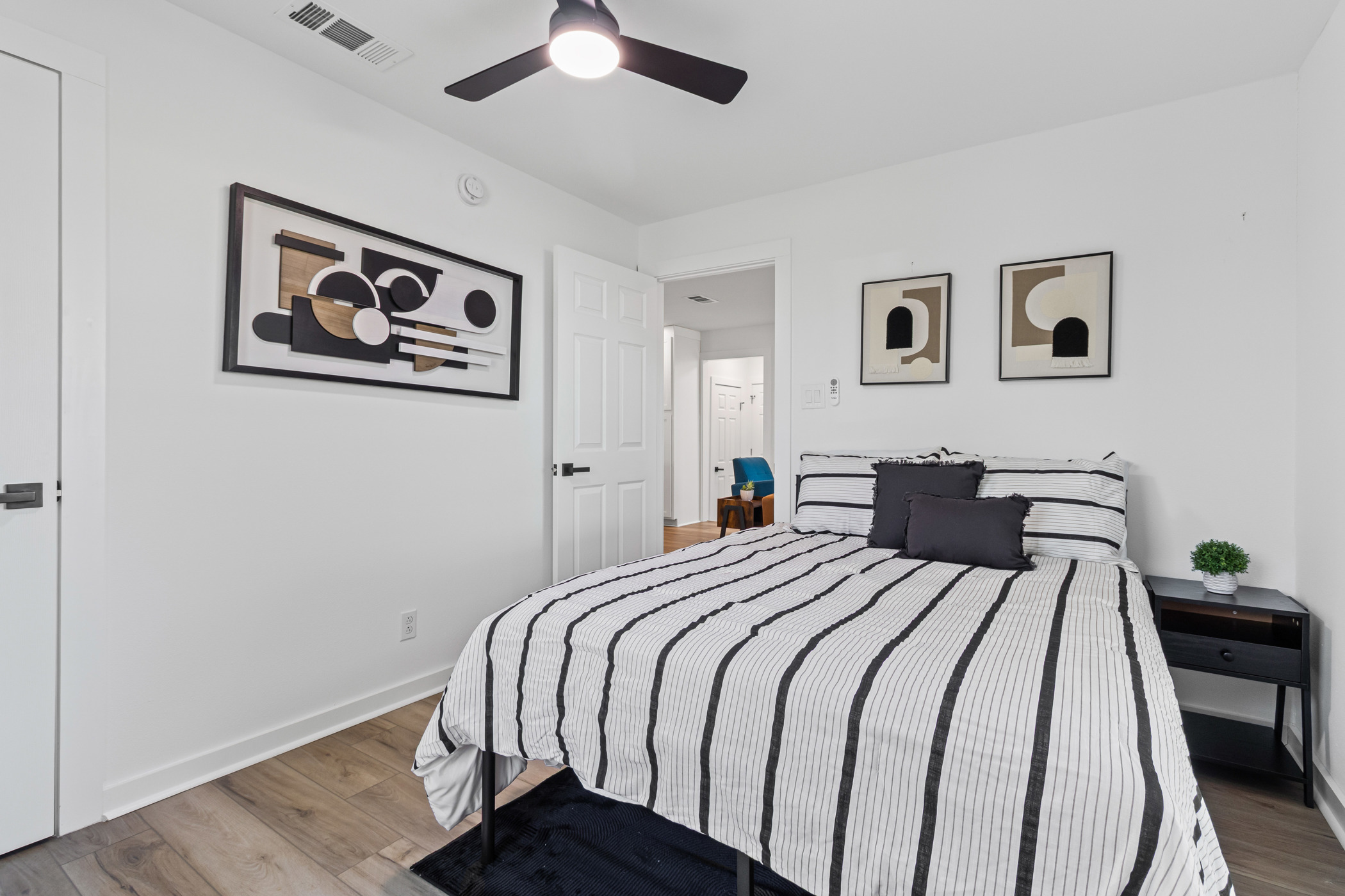 901 North Church Street Georgetown, TX 78626 - Photo 13 of 32 Bedroom featuring light wood-style floors and a ceiling fan