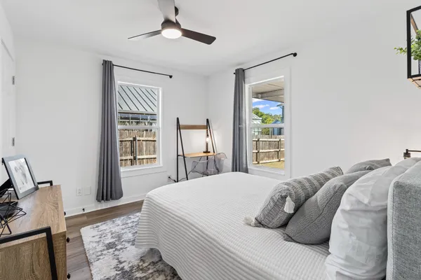 a bedroom with a bed and a window