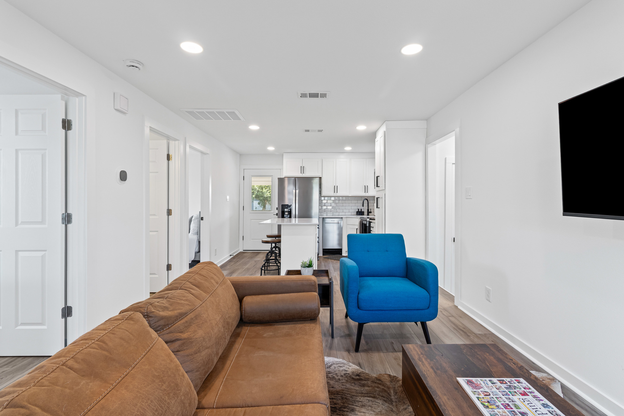 901 North Church Street Georgetown, TX 78626 - Photo 2 of 32 Living room with recessed lighting and wood finished floors