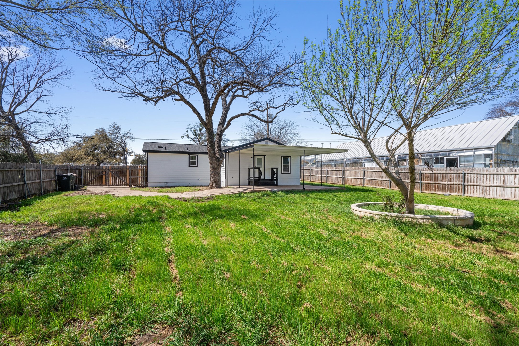 901 North Church Street Georgetown, TX 78626 - Photo 32 of 32 Back of house with a patio area and a fenced backyard