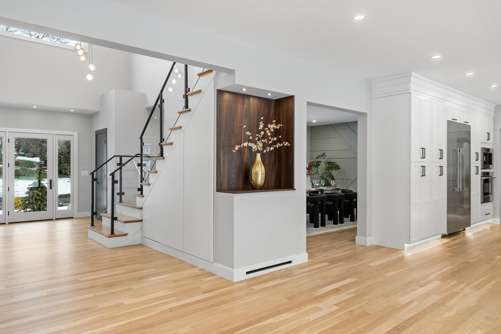 68 Longmeadow Road Belmont, MA 02478 - Photo 11 of 39 a view of a hallway with wooden floor and windows