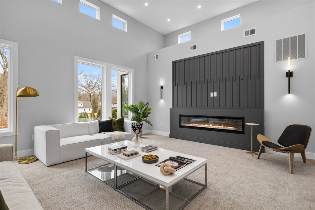 68 Longmeadow Road Belmont, MA 02478 - Photo 14 of 39 a living room with furniture a rug and a fireplace