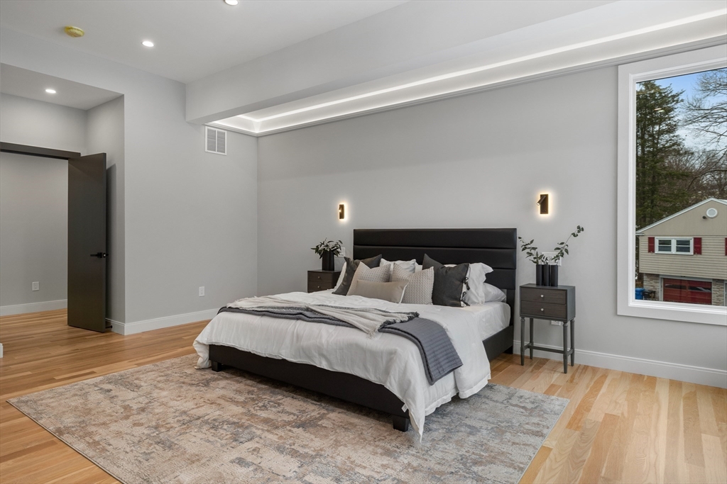 68 Longmeadow Road Belmont, MA 02478 - Photo 16 of 39 a bedroom with a bed and a flat screen tv