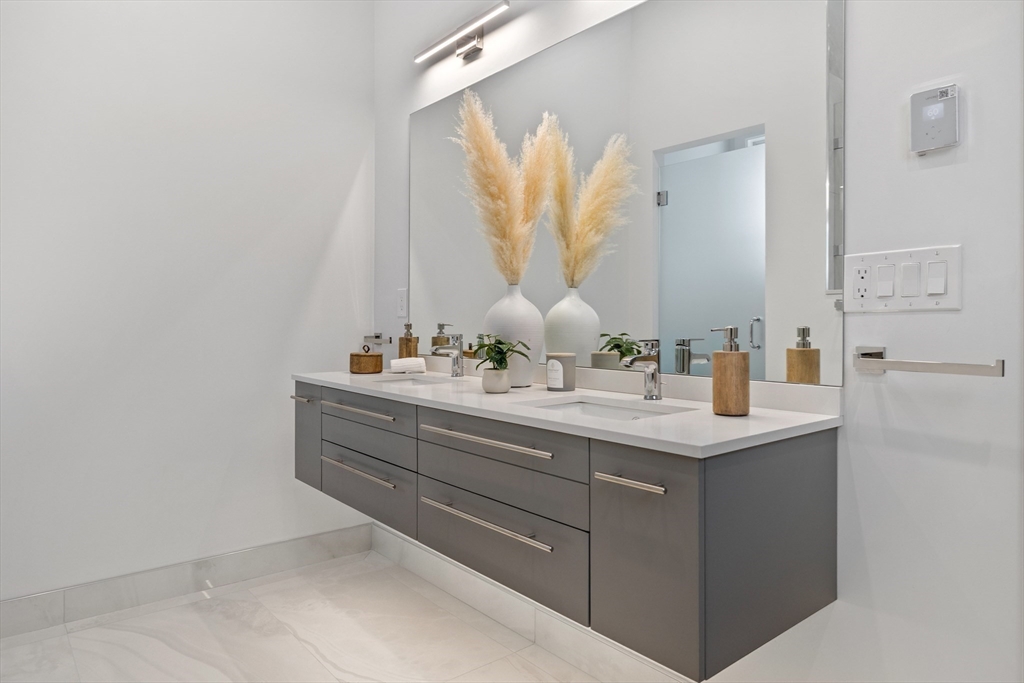 68 Longmeadow Road Belmont, MA 02478 - Photo 18 of 39 a bathroom with a sink and a mirror