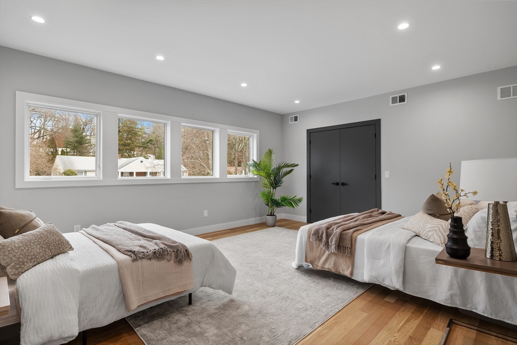 68 Longmeadow Road Belmont, MA 02478 - Photo 24 of 39 a bedroom with a bed and wooden floor