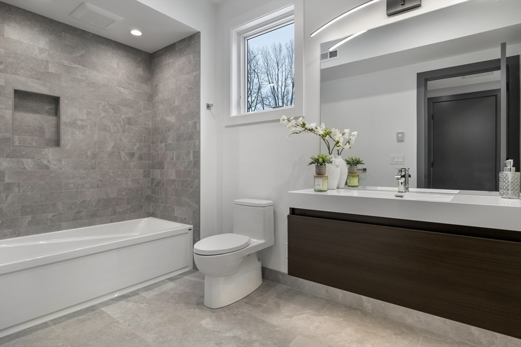 68 Longmeadow Road Belmont, MA 02478 - Photo 25 of 39 a bathroom with a sink a toilet and shower