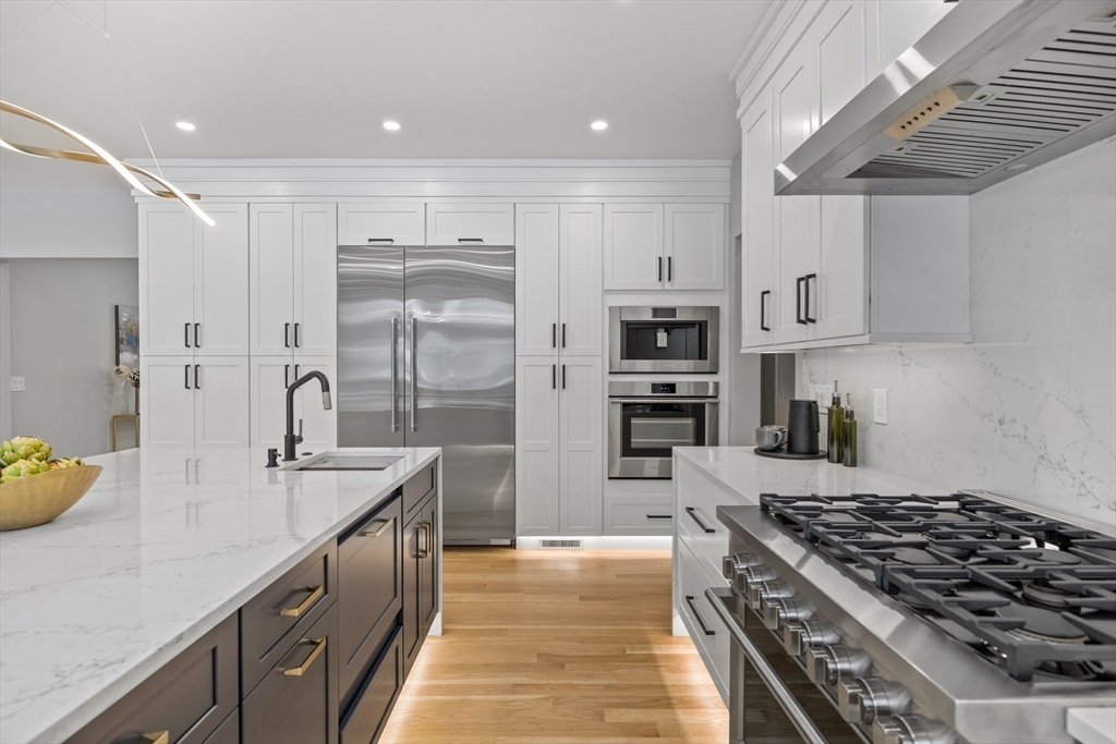 68 Longmeadow Road Belmont, MA 02478 - Photo 3 of 39 a large kitchen with stainless steel appliances granite countertop a lot of counter space and a sink