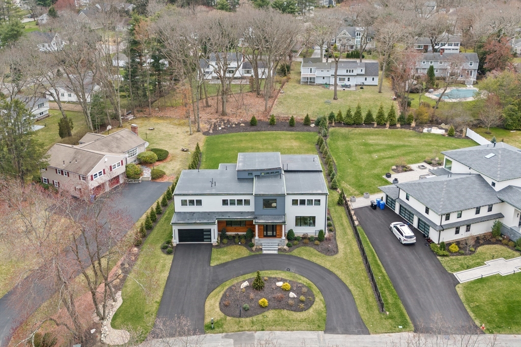 68 Longmeadow Road Belmont, MA 02478 - Photo 32 of 39 an aerial view of a house with outdoor space pool patio and lake view