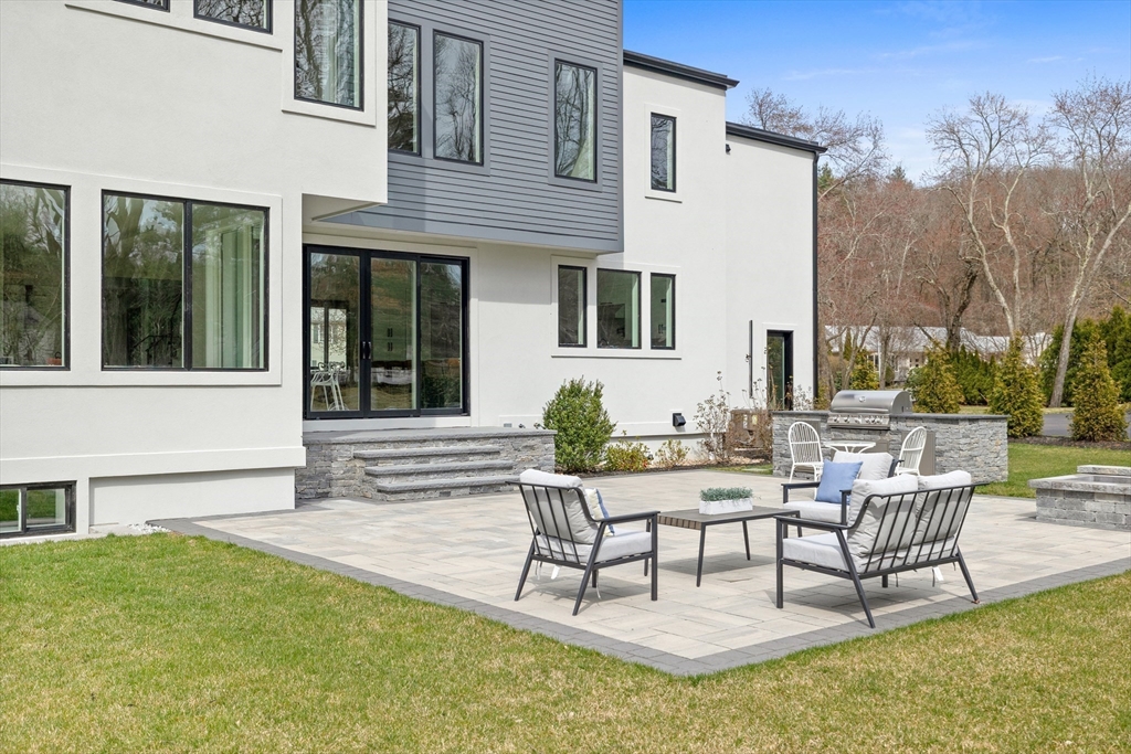68 Longmeadow Road Belmont, MA 02478 - Photo 34 of 39 a view of a house with backyard and sitting area
