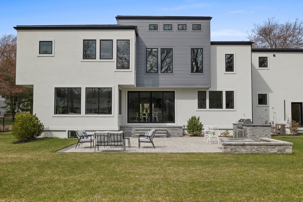 68 Longmeadow Road Belmont, MA 02478 - Photo 35 of 39 a front view of a house with swimming pool