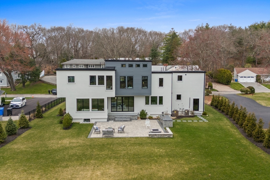 68 Longmeadow Road Belmont, MA 02478 - Photo 38 of 39 a large white building with a yard in front of it
