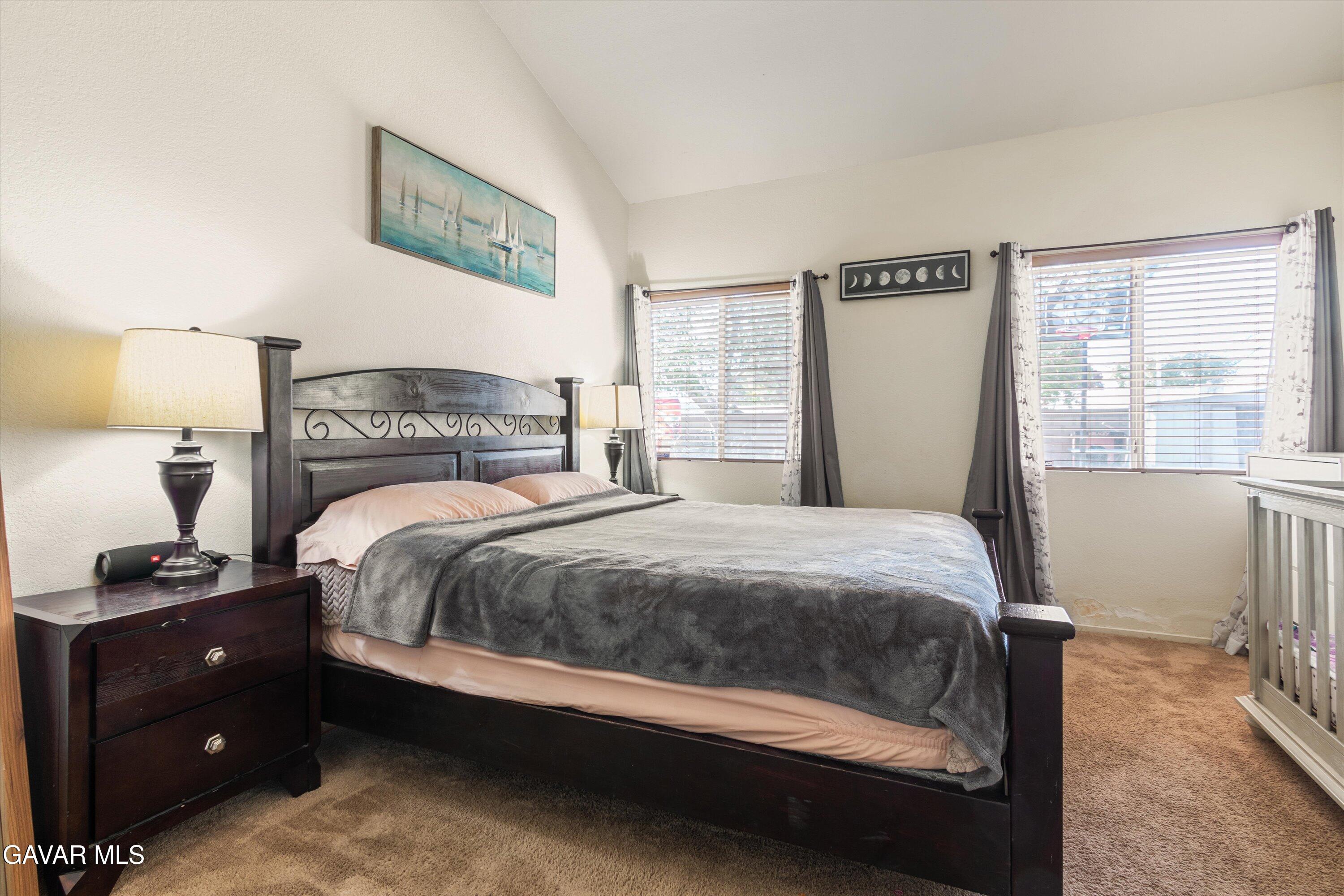 43653 Serenity Court, Unit 1 Lancaster, CA 93535 - Photo 14 of 18 a bedroom with a bed and window