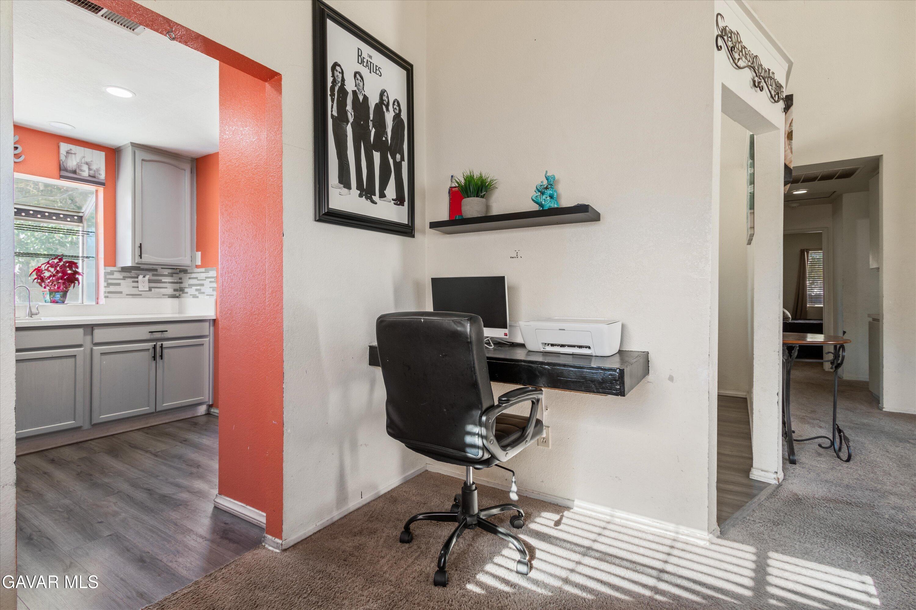 43653 Serenity Court, Unit 1 Lancaster, CA 93535 - Photo 6 of 18 a view of a workspace with furniture and a window