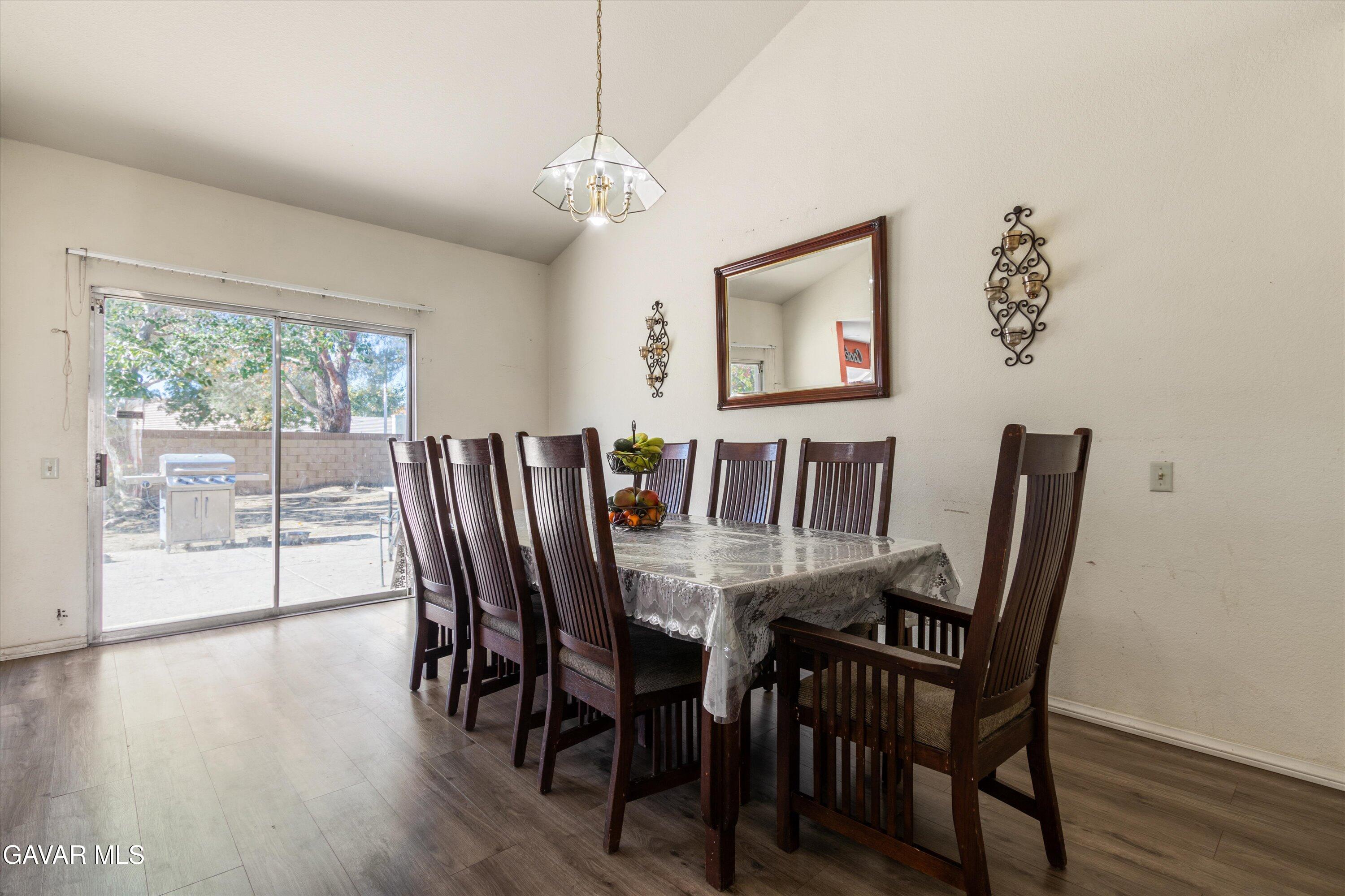 43653 Serenity Court, Unit 1 Lancaster, CA 93535 - Photo 10 of 18 a view of a dining room with furniture window and wooden floor