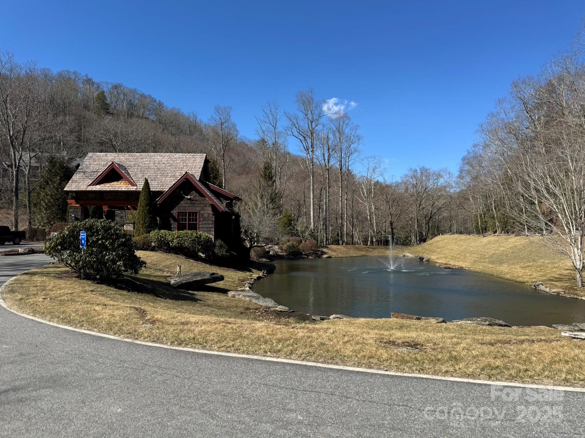 Lot 240 Thunder Wood Trail, Unit 240 Blowing Rock, NC 28605 - Photo 12 of 14 a view of a lake with a house in the background