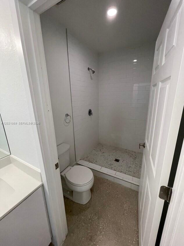 23935 Southwest 110th Court, Unit 23935 Homestead, FL 33032 - Photo 4 of 10 a bathroom with a shower toilet and sink