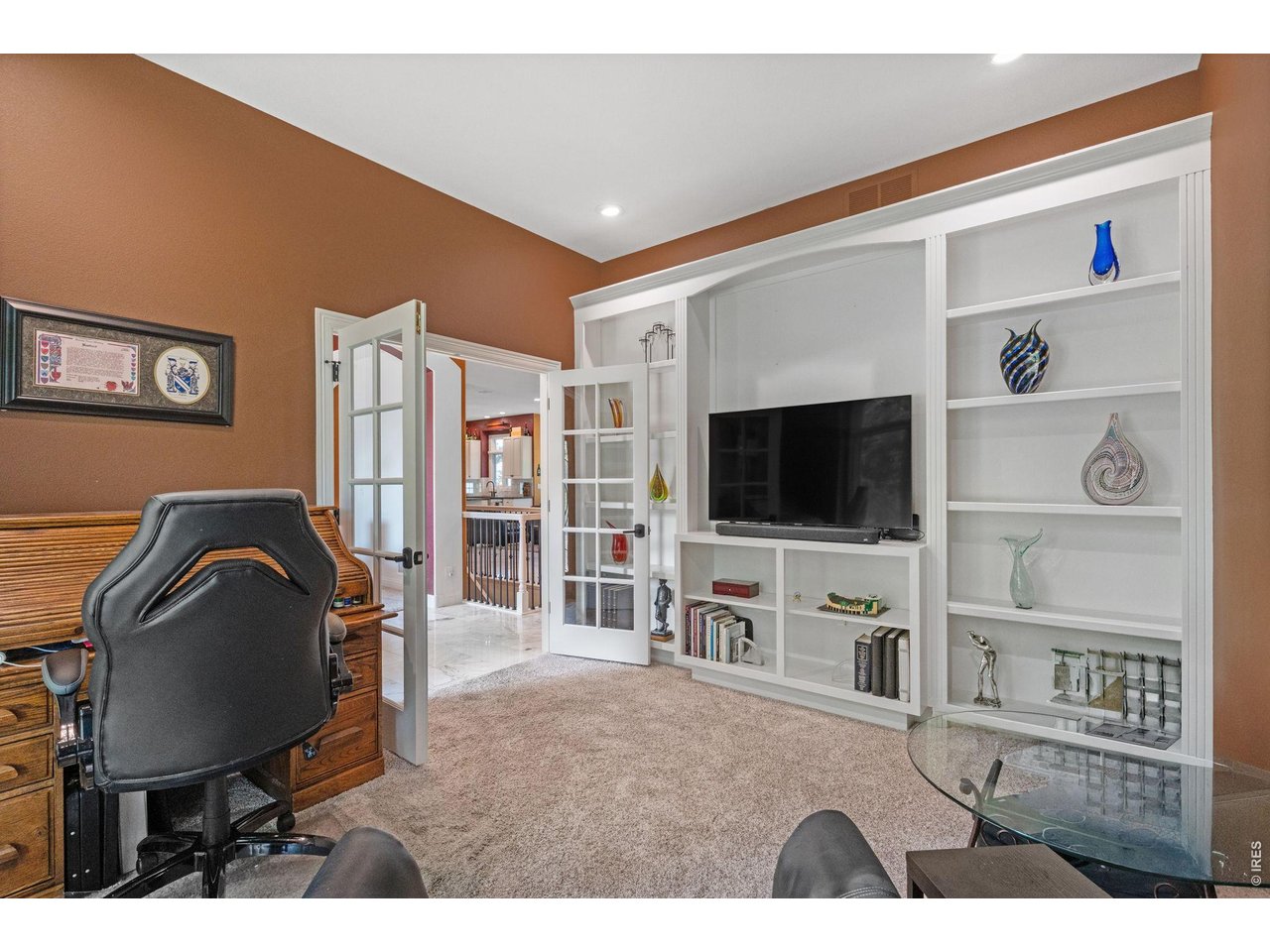 8445 Golden Eagle Road Fort Collins, CO 80528 - Photo 25 of 49 Main Floor Office w/ Custom Built-ins