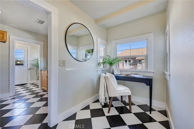 a workspace with wooden floor and a rug