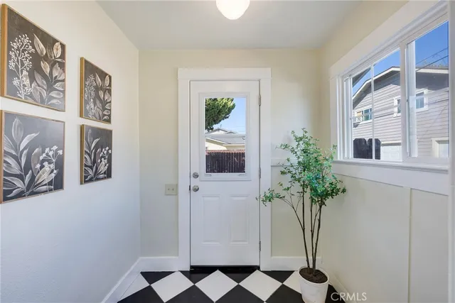 a view of a hallway with paintings on the wall