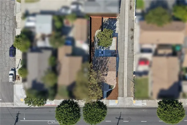 a view of house with backyard and seating space
