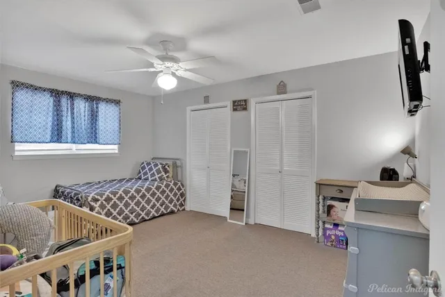 a bedroom with furniture and wooden floor