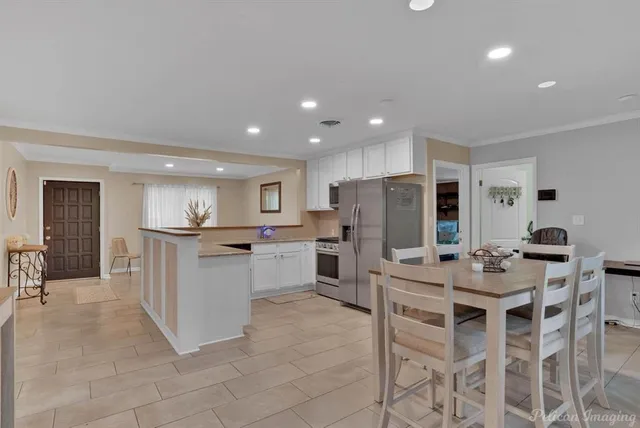 a kitchen with appliances and cabinets