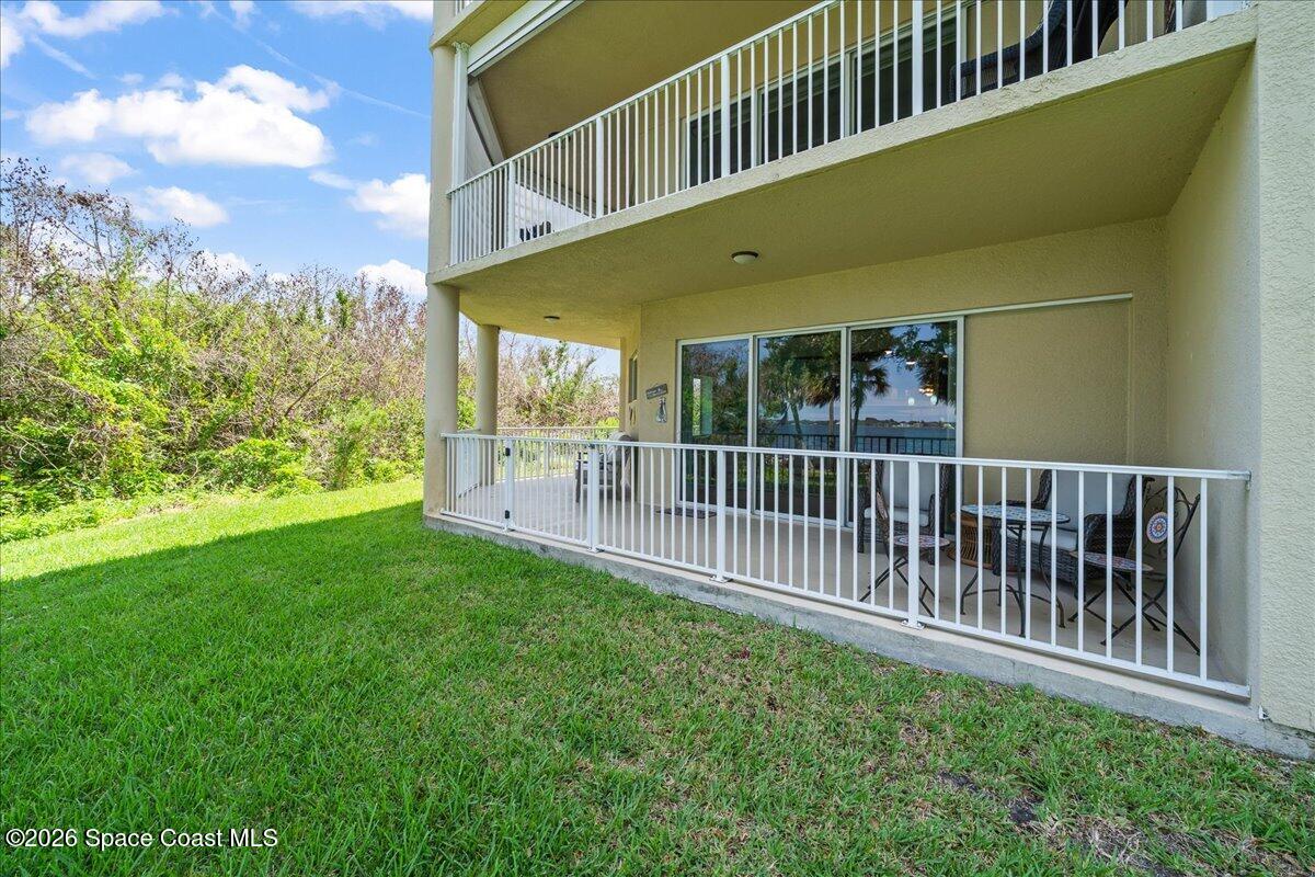 6005 Highway 1, Unit 101 Rockledge, FL 32955 - Photo 34 of 57 a view of a house with a small yard
