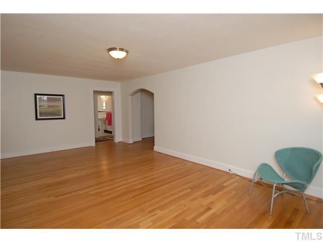 1919 Ruffin Street Durham, NC 27704 - Photo 13 of 25 In this living room view if you look through the doorway you see the hall bath and to either end of that hall there is a bedroom door ( to the front or middle bedroom). Living Room