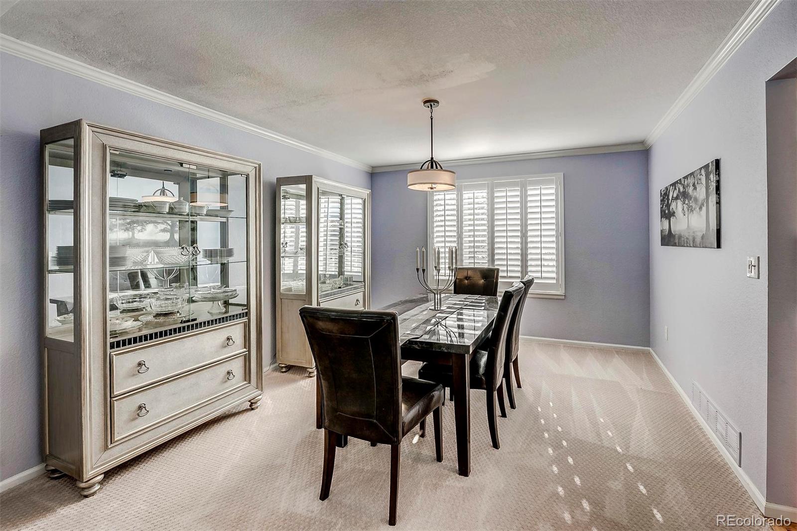 9847 Spring Hill Lane Highlands Ranch, CO 80129 - Photo 11 of 33 a dining room with furniture and window