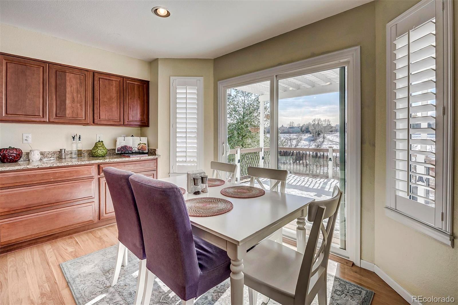 9847 Spring Hill Lane Highlands Ranch, CO 80129 - Photo 14 of 33 a view of a dining room with furniture window and outside view