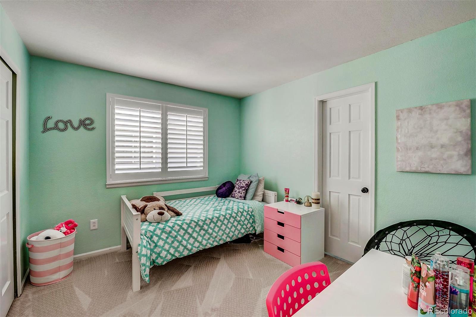 9847 Spring Hill Lane Highlands Ranch, CO 80129 - Photo 29 of 33 a bedroom with baby crib and a window