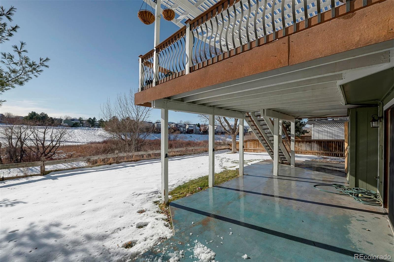 9847 Spring Hill Lane Highlands Ranch, CO 80129 - Photo 3 of 33 a patio with water view